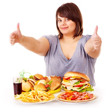 Woman eating fast food. clipart