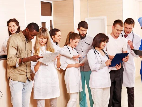 Group doctors at reception in hospital. — Stock Photo, Image