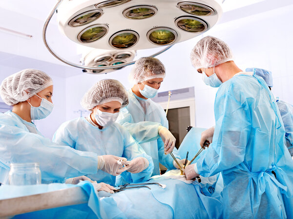 Surgeon at work in operating room.