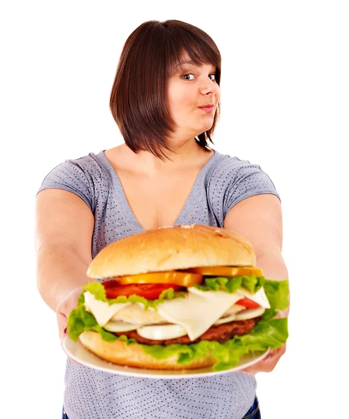 Mulher com excesso de peso comer hambúrguer . — Fotografia de Stock