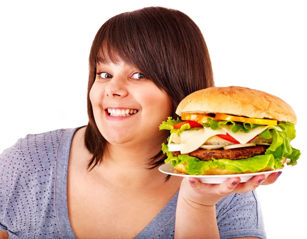 Žena jíst hamburger. — Stock fotografie