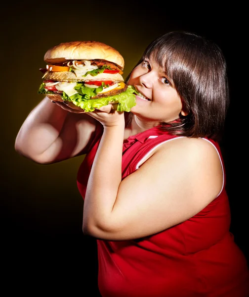 Hungry woman holding hamburger. — Stock Photo, Image