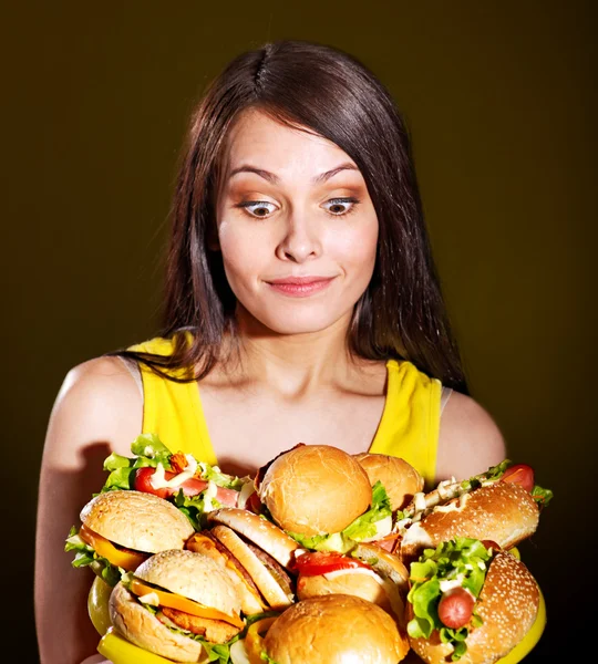 stock image Woman holding hamburger.