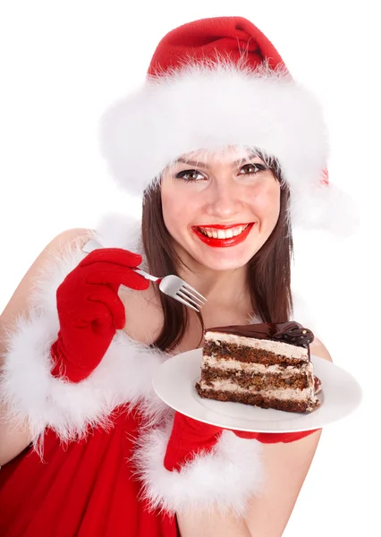 Navidad chica en santa hat comer pastel en plato . —  Fotos de Stock