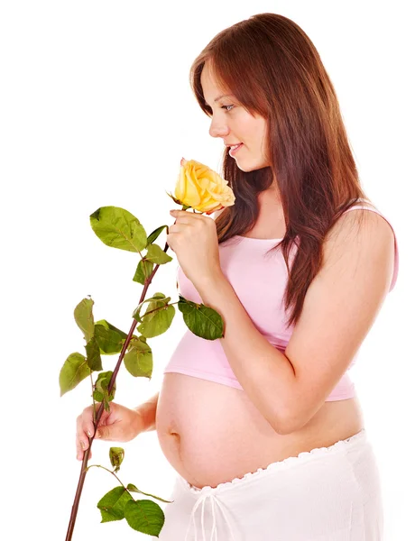 妊娠中の女性の花を持つ. — ストック写真