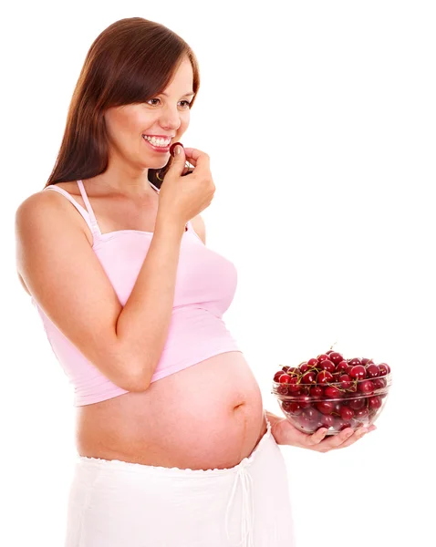 Беременная женщина ест фрукты . — стоковое фото
