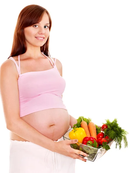 Mujer embarazada comiendo vegetales . —  Fotos de Stock