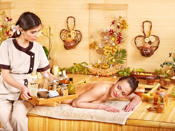 Woman getting massage in bamboo spa. — Stock Photo, Image