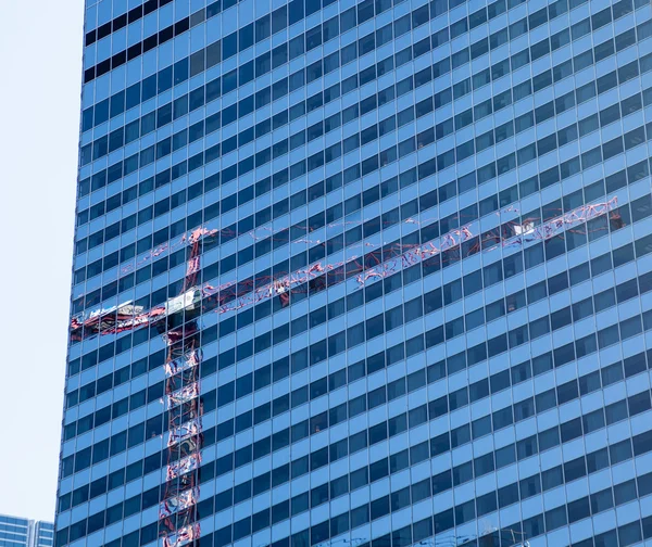 Reflection of crane in Chicago windows — Stock Photo, Image