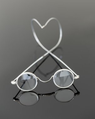 Pair of old magnifying reading glasses clipart