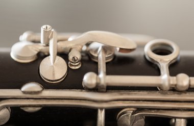 Macro image of keys and pads of clarinet clipart