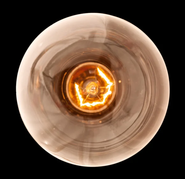 Incandescent light bulb lit from above — Stock Photo, Image