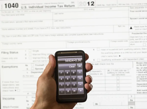 Formulario fiscal de EE.UU. 1040 para el año 2012 y calculadora —  Fotos de Stock