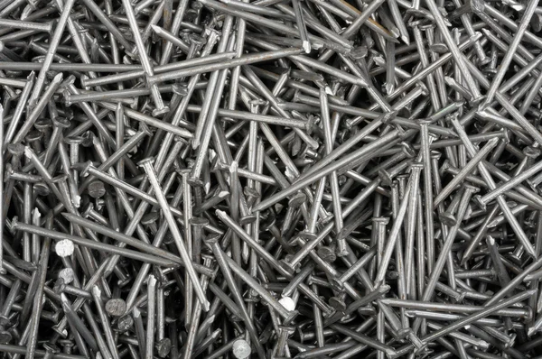 Background from the heap of small iron nails — Stock Photo, Image