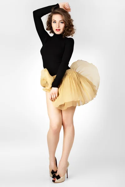The young girl's skirt flies. — Stock Photo, Image