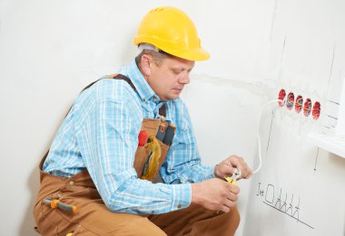 Electricians at cable wiring work clipart