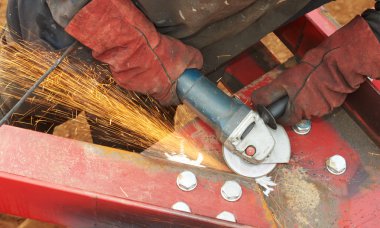 Grinding machine works with sparks clipart