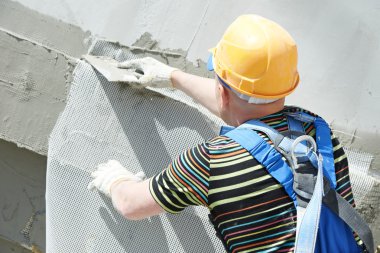 Facade builder plasterer at work clipart