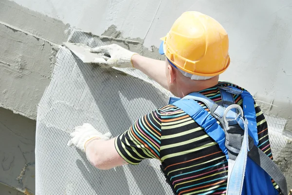 Facade builder plasterer at work — Stock Photo, Image