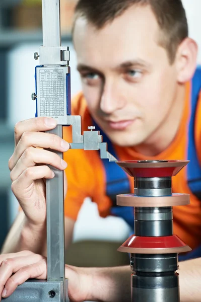 Worker measuring cutting tool — Stock Photo, Image