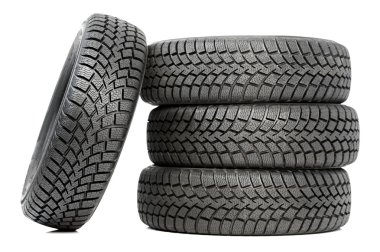 Stack of four car wheel winter tires isolated clipart