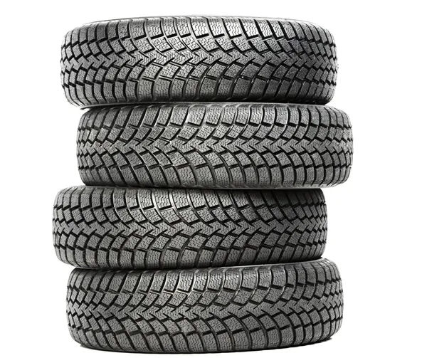Stack of four car wheel winter tires isolated — Stockfoto