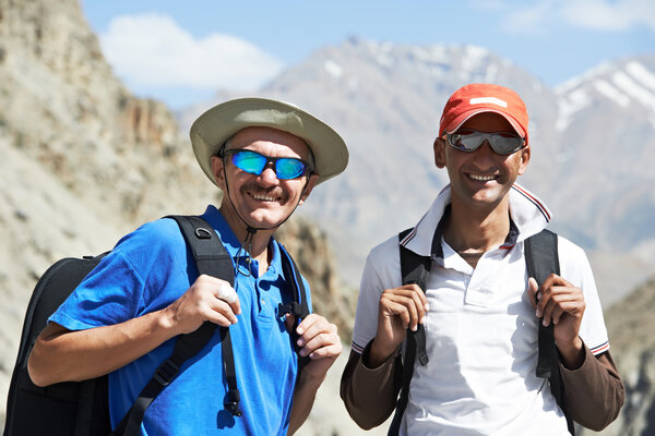 Two smiling tourist hiker in india mountains