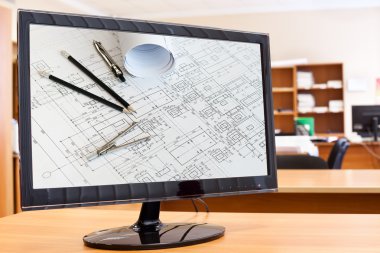 Computer monitor with blueprints and drawing tools picture in screen on desktop clipart