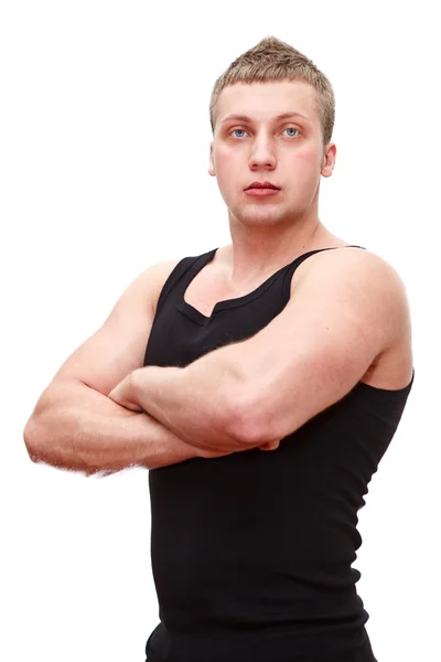 Een knappe Kaukasische musculan man in zwart t-shirt met geklemd handen — Stockfoto