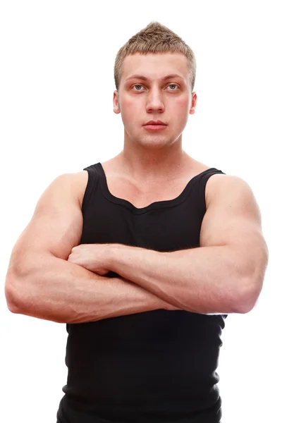 Un bel homme musculan caucasien en t-shirt noir avec les mains jointes — Photo