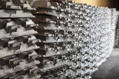 Stack of raw aluminum ingots in aluminium factory