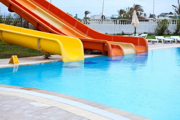 Plastic water slides in the swimming pool — Stock Photo, Image
