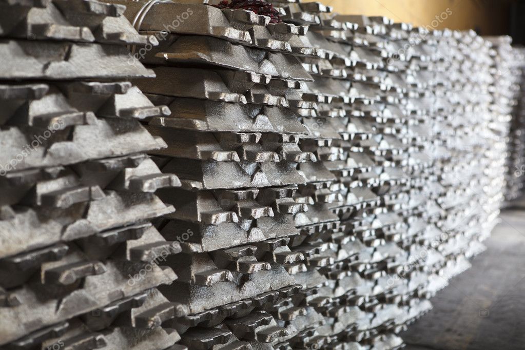 Stack of raw aluminum ingots in aluminium factory — Stock Photo © antiksu  #10950021