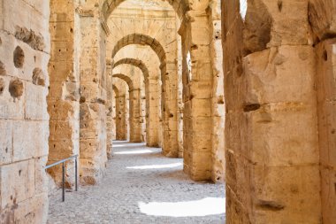 Ancient arches of ruins in Tunisian Amphitheatre in El Djem, Tunisia clipart