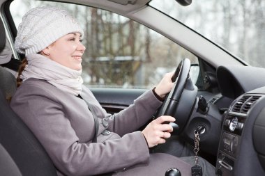 Woman driving a car looking forward clipart