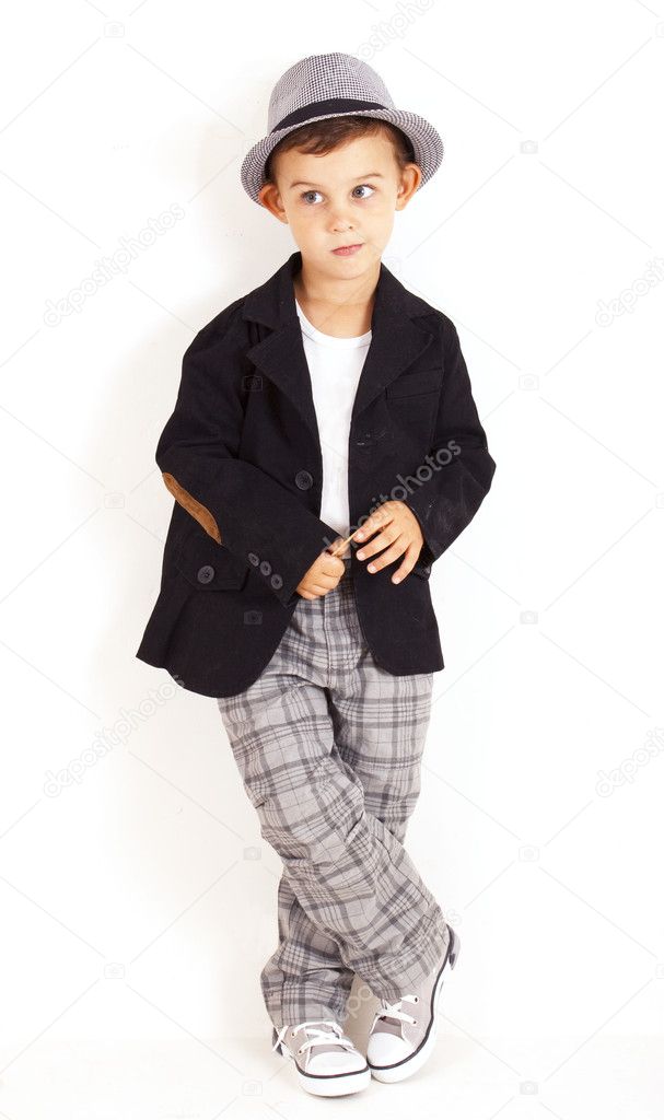 Pensive cool pretty stylish little boy isolated on white