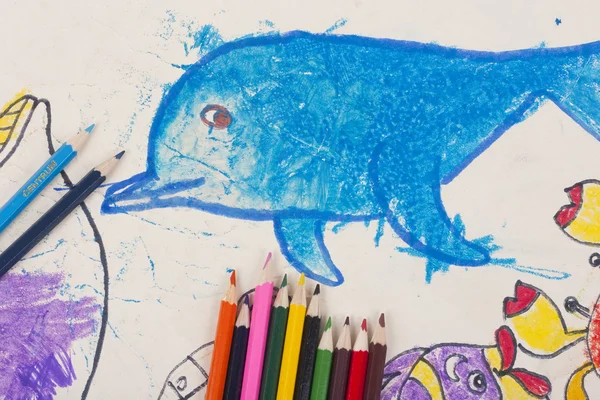 Child's drawing a dolphin and pencils — Stock Photo, Image