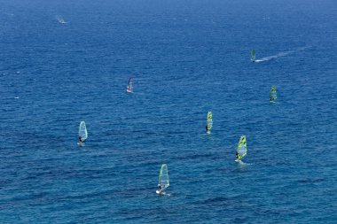 Aerial view of windsurfers on the sea clipart