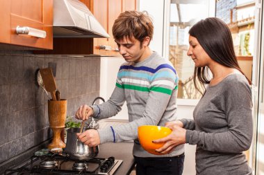 Happy Multiracial Couple in the Kitchen clipart