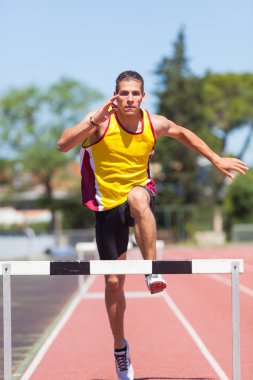 Male Track and Field Athlete during Obstacle Race clipart