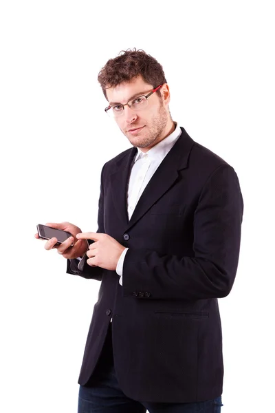 Ung affärsman med smartphone på vit — Stockfoto