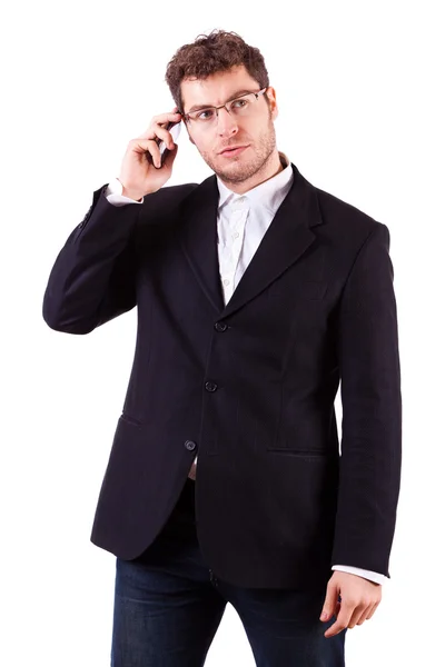 Ung affärsman med smartphone på vit — Stockfoto