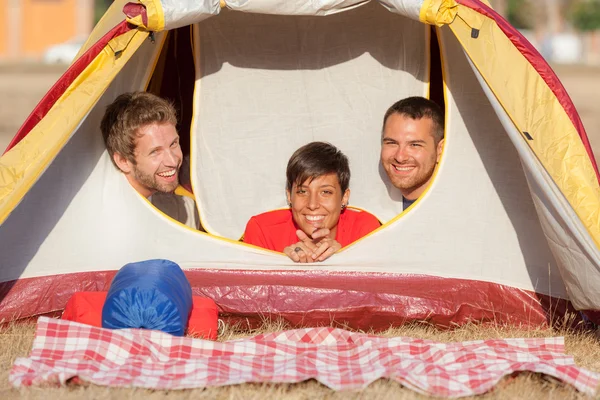Three Friends Camping Inside the Tent — Stock Photo, Image