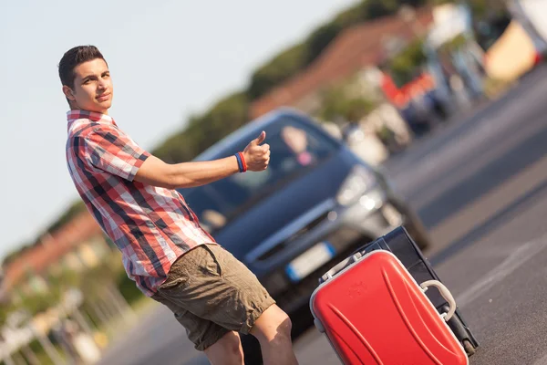 Young Man Hitchhiking — Stock Photo, Image