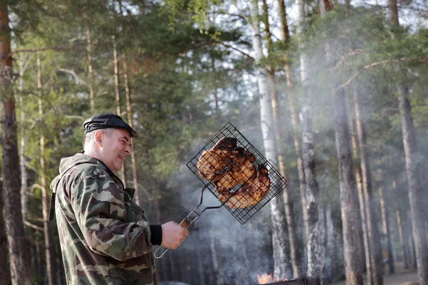 Portrait of man with grill — Stock Photo, Image