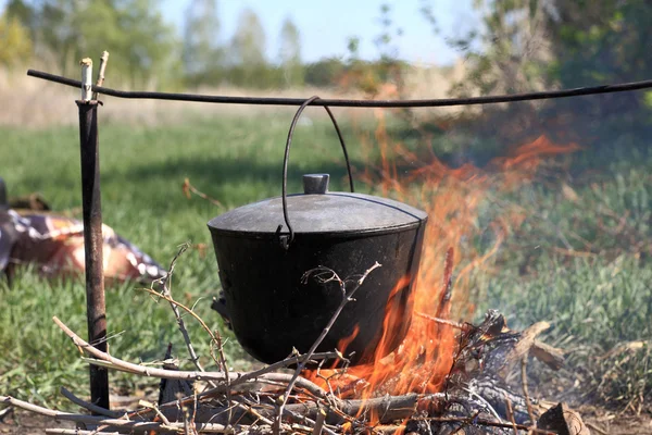 Cauldron on bonfire — Stock Photo, Image
