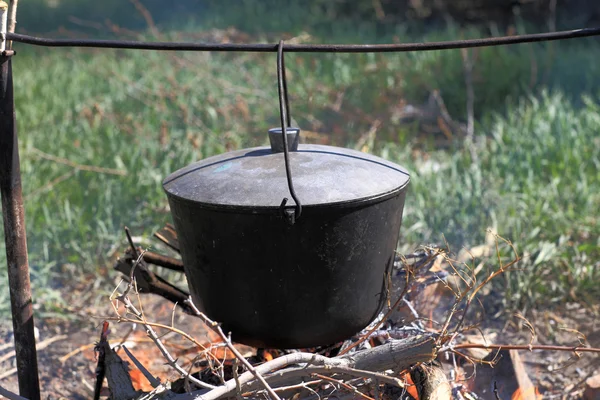 Cauldron with fish soup — Stock Photo, Image