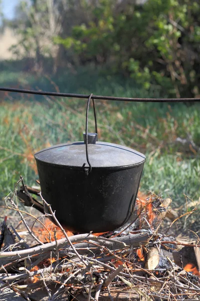 Fish soup preparation in cauldron — Stock Photo, Image