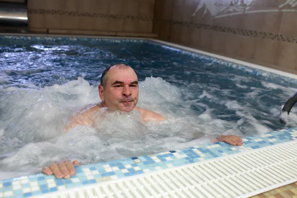 Mature man in jacuzzi — Stock Photo, Image