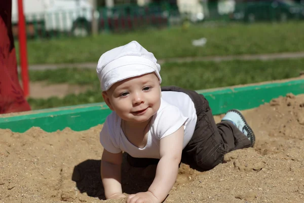 Happy boy in sandbox — Stock Photo, Image